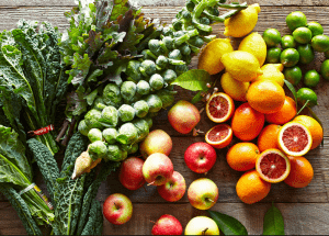a group of fruits and vegetables on a wood surface Healthy Weight Loss Diets Huntingdon