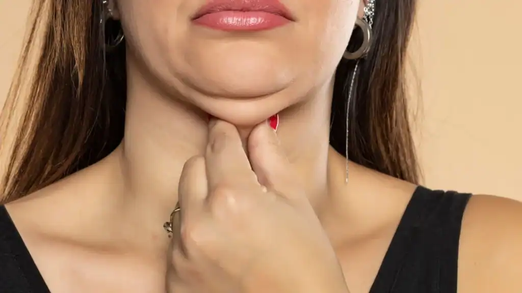 An image of a woman with double chin, sad, worried : Non Surgical Double Chin Removal Treatment in Huntingdon, UK